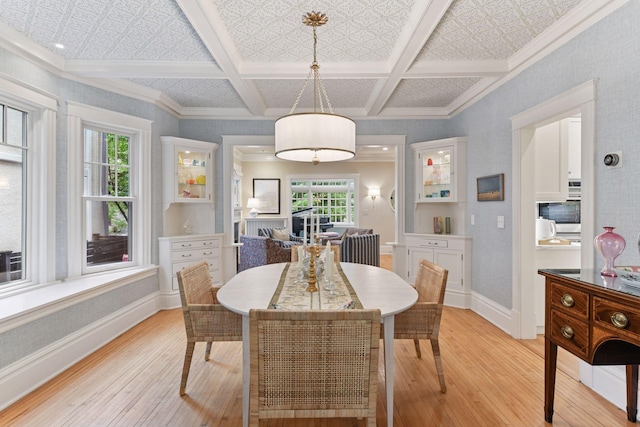 4943 Dupont Ave S, Minneapolis, MN 55419 - dining area featuring light wood-type flooring, coffered ceiling, beam ceiling, and crown molding