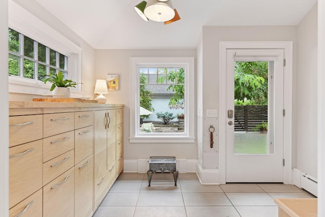 4943 Dupont Ave S, Minneapolis, MN 55419 - doorway with light tile patterned flooring and a baseboard radiator