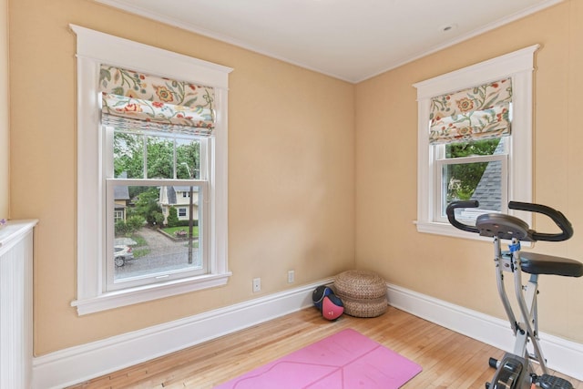 4943 Dupont Ave S, Minneapolis, MN 55419 - exercise area featuring wood finished floors, healthy amount of natural light, and ornamental molding