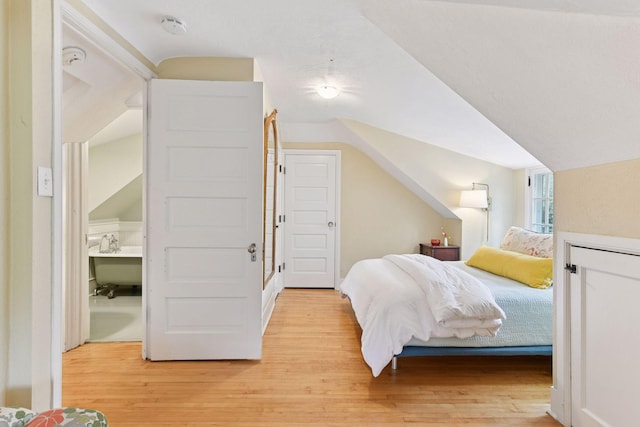 4943 Dupont Ave S, Minneapolis, MN 55419 - bedroom featuring light wood finished floors and vaulted ceiling