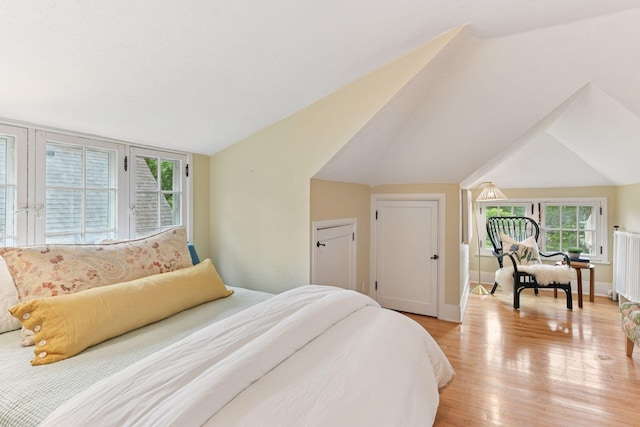 4943 Dupont Ave S, Minneapolis, MN 55419 - bedroom with light wood-style flooring and lofted ceiling