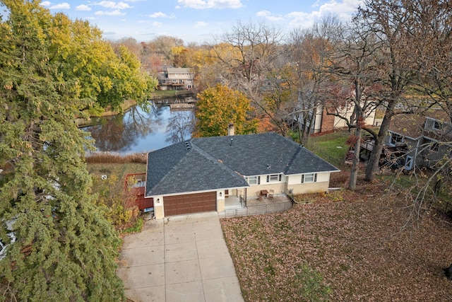 drone / aerial view with a water view