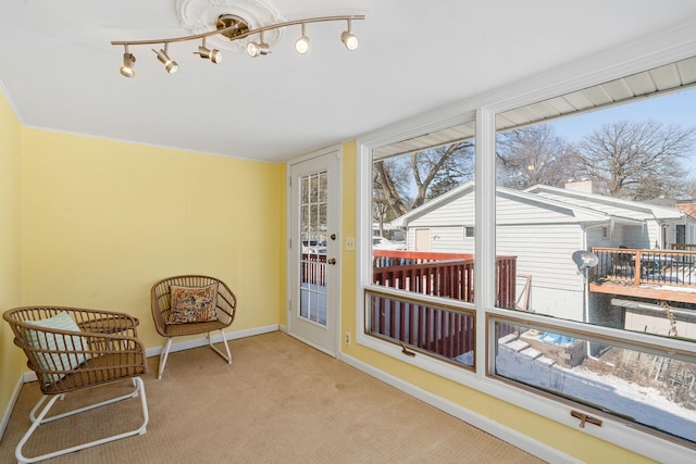 sunroom with rail lighting