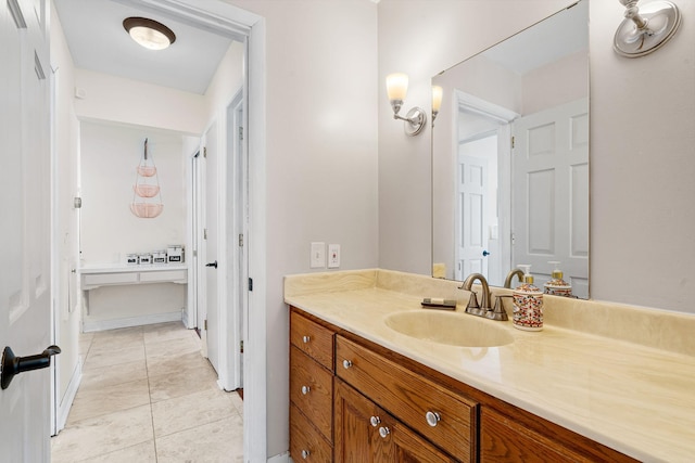 bathroom featuring tile patterned flooring and vanity