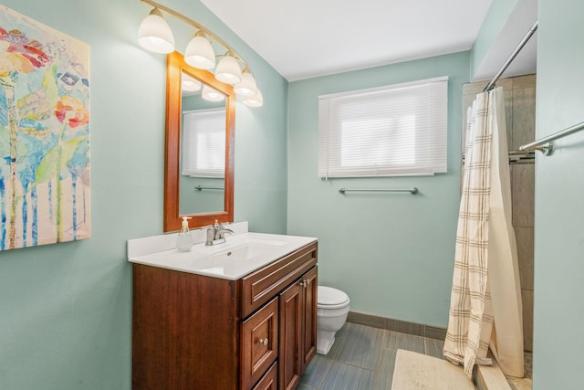 bathroom featuring curtained shower, baseboards, toilet, and vanity