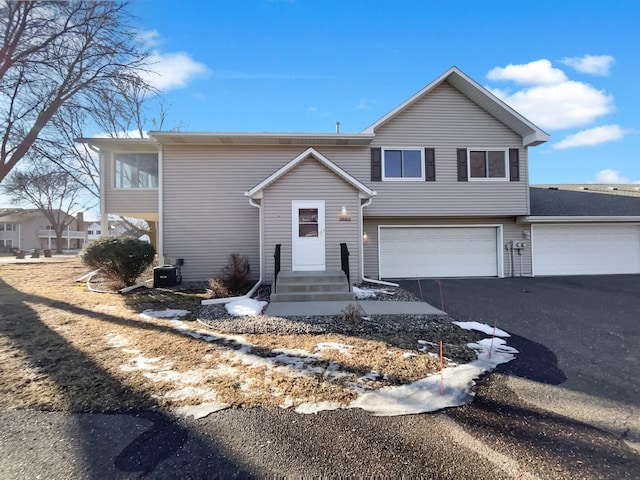 view of front of property with a garage and driveway