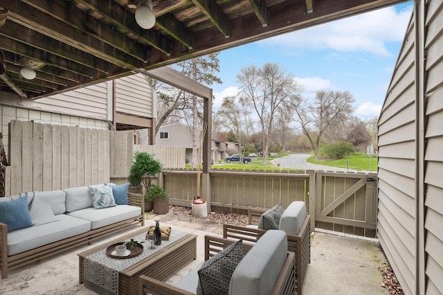 view of patio / terrace with fence, an outdoor living space, and a gate