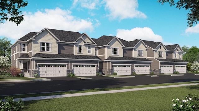 view of front facade with driveway, an attached garage, and a residential view