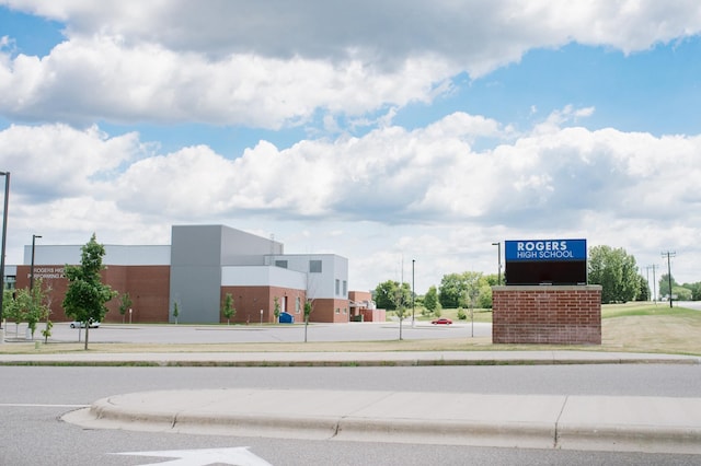 view of road with sidewalks and curbs