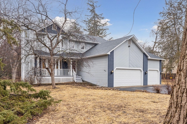 traditional-style home with aphalt driveway, a porch, brick siding, and roof with shingles