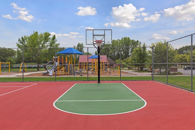 view of basketball court with community basketball court, playground community, and fence