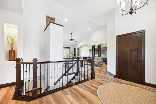 4680 Spruce Way, Medina, MN 55359 - hall with an upstairs landing, light wood-style floors, high vaulted ceiling, baseboards, and recessed lighting
