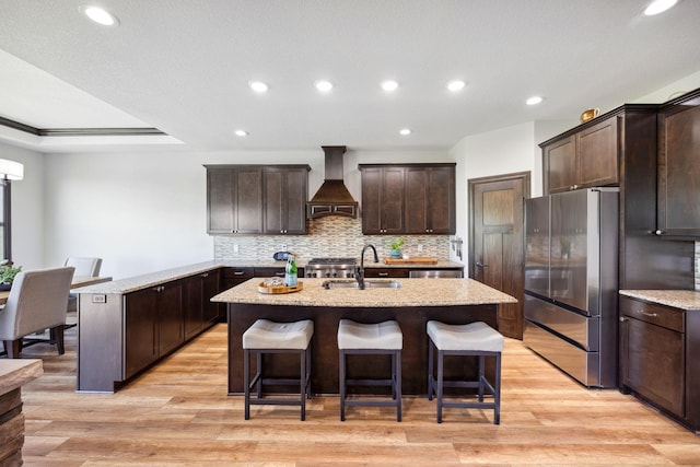 4680 Spruce Way, Medina, MN 55359 - kitchen featuring freestanding refrigerator, custom exhaust hood, a sink, dark brown cabinets, and recessed lighting
