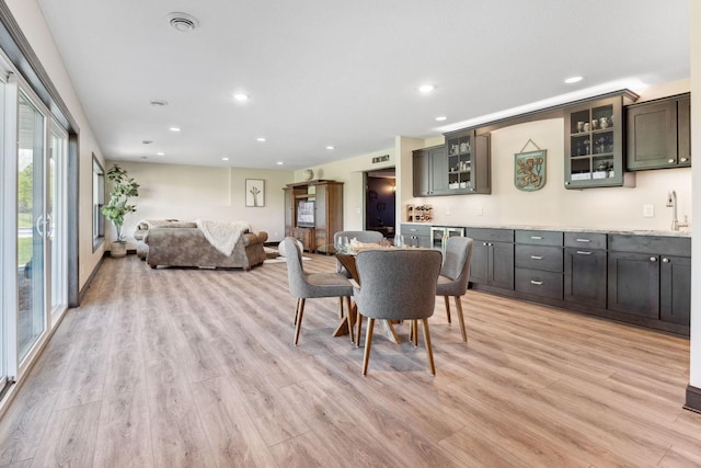 4680 Spruce Way, Medina, MN 55359 - dining area featuring light wood-style flooring, recessed lighting, and bar