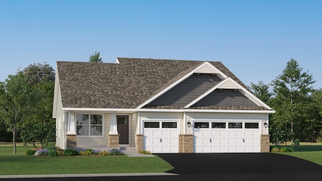 craftsman-style house featuring a front yard and a garage