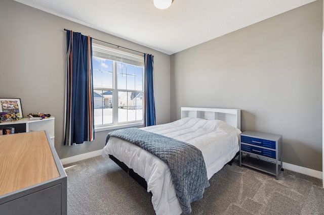 carpeted bedroom featuring baseboards