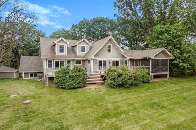 6388 Jasmine Ave N, Stillwater, MN 55082 - back of property with a sunroom, a deck, a yard, and a shingled roof