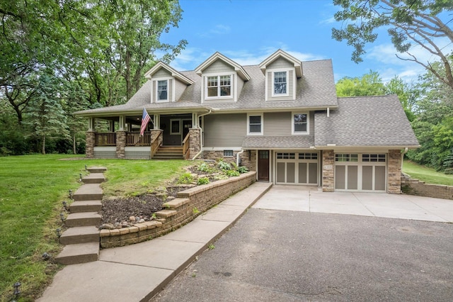 6388 Jasmine Ave N, Stillwater, MN 55082 - view of front facade with asphalt driveway, a porch, a front lawn, a shingled roof, and stone siding