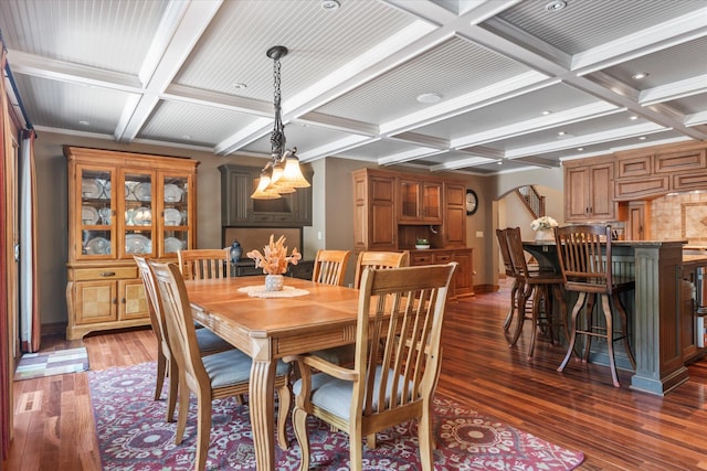 6388 Jasmine Ave N, Stillwater, MN 55082 - dining space featuring coffered ceiling, beam ceiling, hardwood / wood-style floors, arched walkways, and recessed lighting