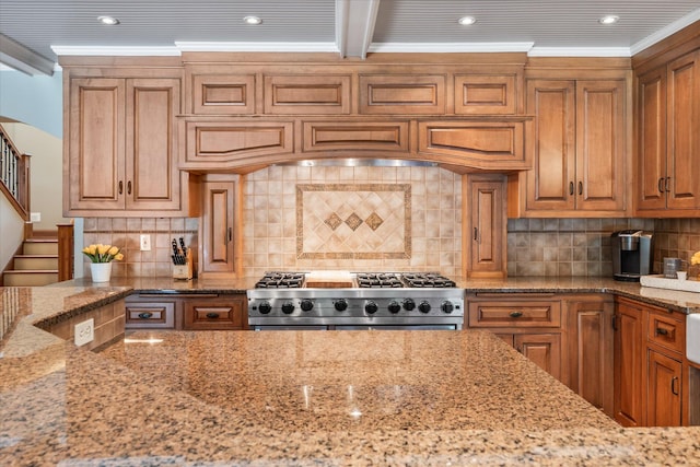 6388 Jasmine Ave N, Stillwater, MN 55082 - kitchen featuring stainless steel stove, light stone counters, backsplash, ornamental molding, and recessed lighting