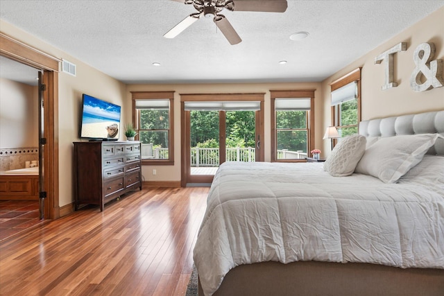 6388 Jasmine Ave N, Stillwater, MN 55082 - bedroom with access to outside, wood finished floors, a textured ceiling, recessed lighting, and a ceiling fan