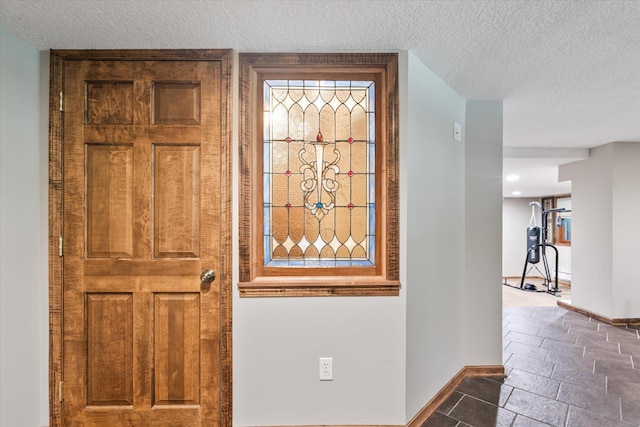 6388 Jasmine Ave N, Stillwater, MN 55082 - foyer entrance featuring a textured ceiling and baseboards