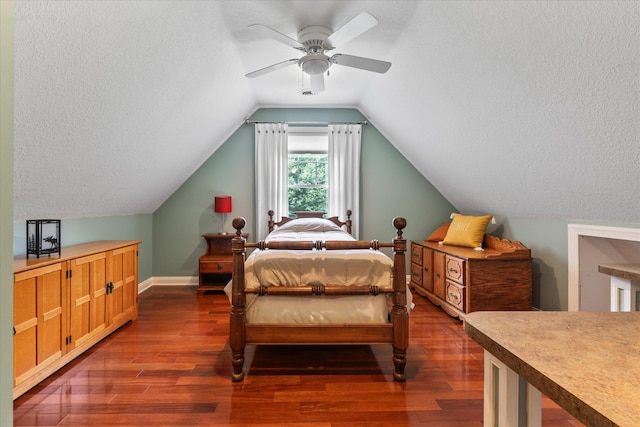 6388 Jasmine Ave N, Stillwater, MN 55082 - bedroom featuring dark wood-style floors, a textured ceiling, lofted ceiling, and ceiling fan