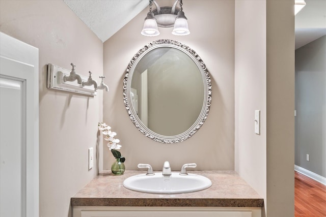 6388 Jasmine Ave N, Stillwater, MN 55082 - bathroom with vanity, wood finished floors, and lofted ceiling