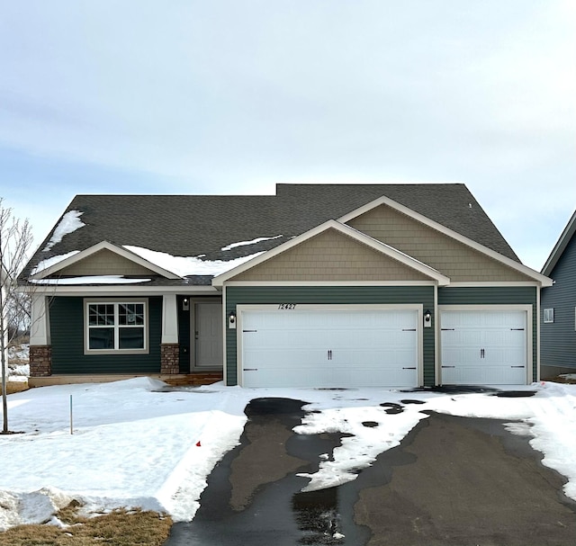 craftsman-style house featuring driveway and an attached garage