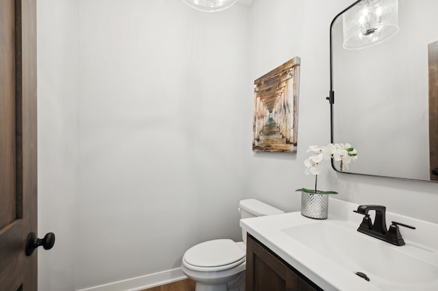 bathroom featuring toilet and vanity