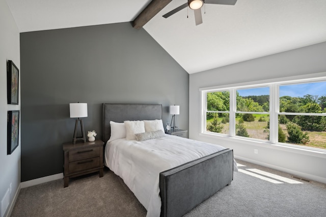 carpeted bedroom with vaulted ceiling with beams and ceiling fan