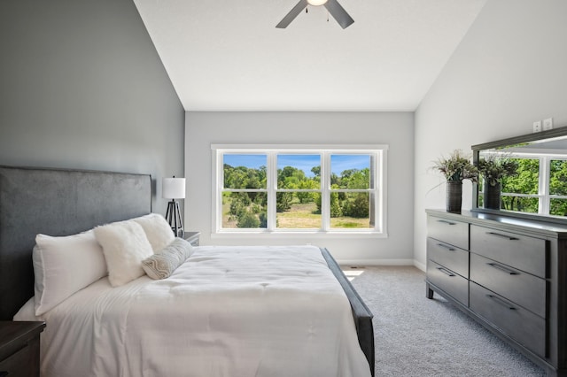 carpeted bedroom with vaulted ceiling and ceiling fan