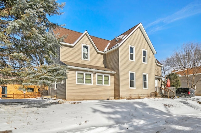 view of snow covered house