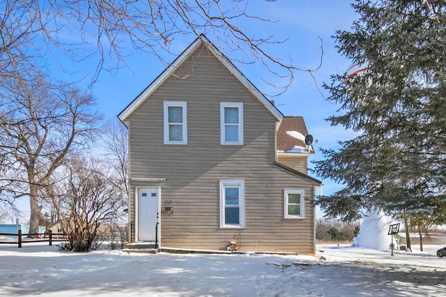 traditional-style home featuring entry steps