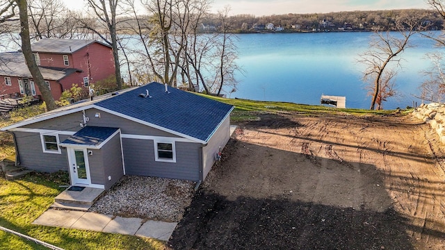 exterior space with a water view