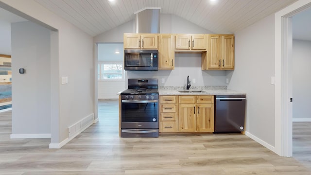 kitchen featuring visible vents, light wood-style flooring, appliances with stainless steel finishes, light brown cabinets, and a sink