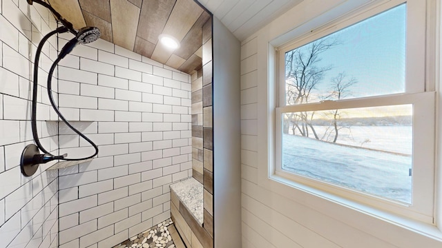 bathroom featuring a tile shower