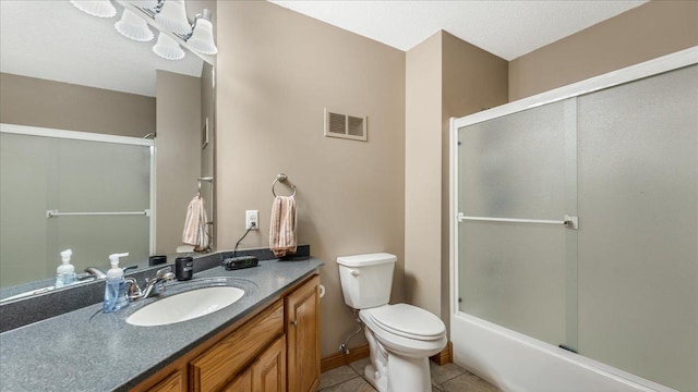 full bath with visible vents, bath / shower combo with glass door, toilet, tile patterned floors, and vanity