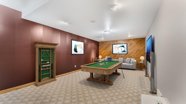 rec room featuring pool table, light colored carpet, wooden walls, and baseboards