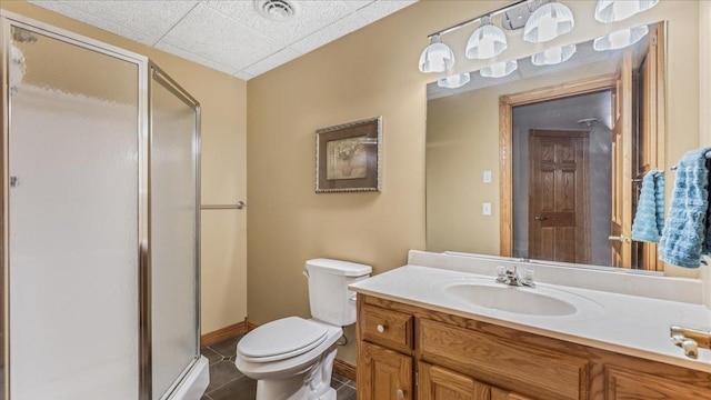 bathroom with toilet, visible vents, vanity, a shower stall, and tile patterned floors