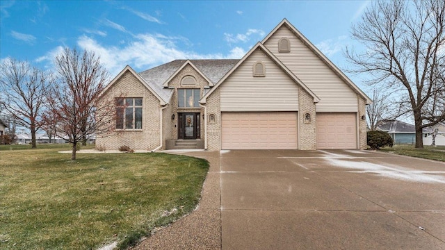 view of front of property with brick siding, a front lawn, a garage, and driveway