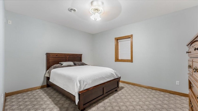 bedroom with visible vents, baseboards, and carpet
