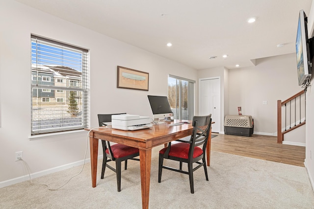 office with light wood-type flooring