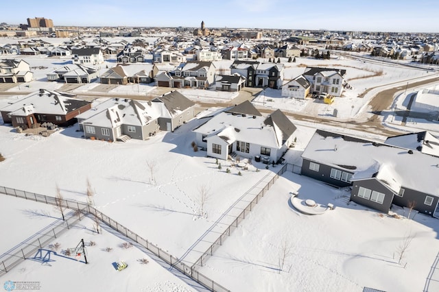 snowy aerial view featuring a residential view
