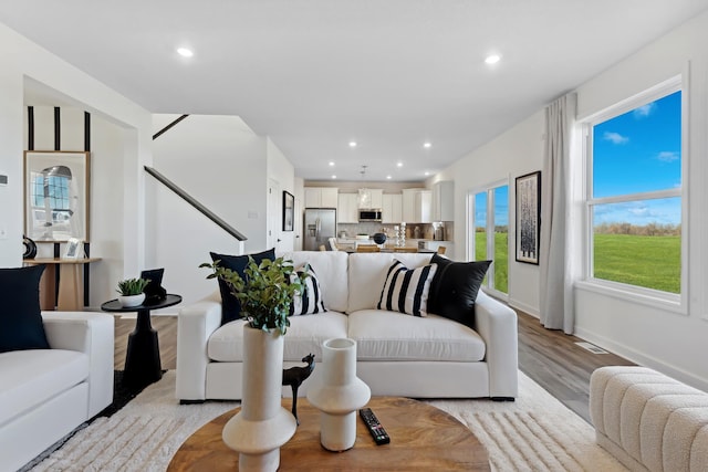 living room with light hardwood / wood-style floors