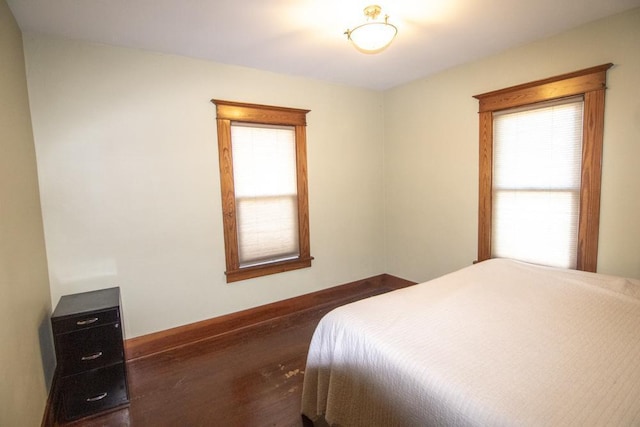 bedroom featuring dark hardwood / wood-style flooring