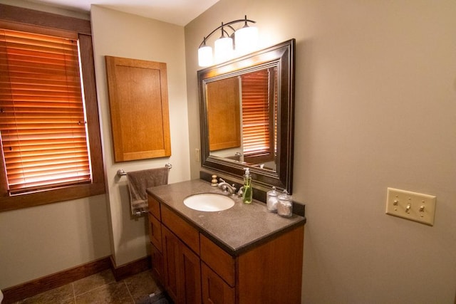 bathroom with tile patterned flooring and vanity