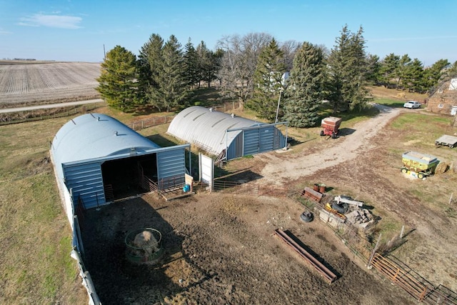 birds eye view of property with a rural view