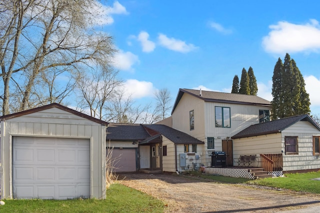 traditional home with dirt driveway, board and batten siding, a deck, and a shingled roof