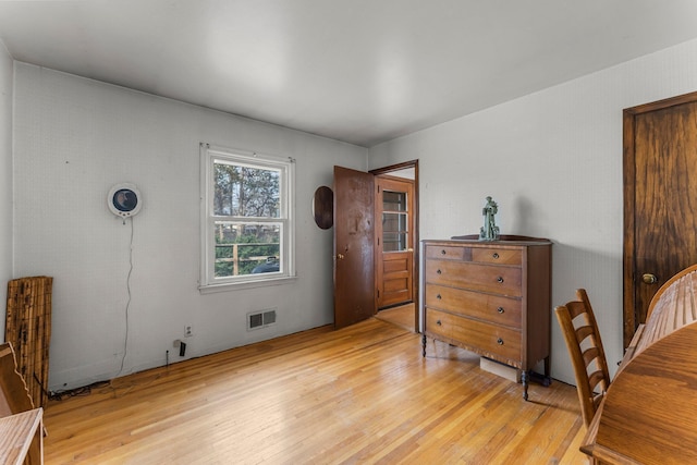 interior space featuring visible vents and light wood-style floors